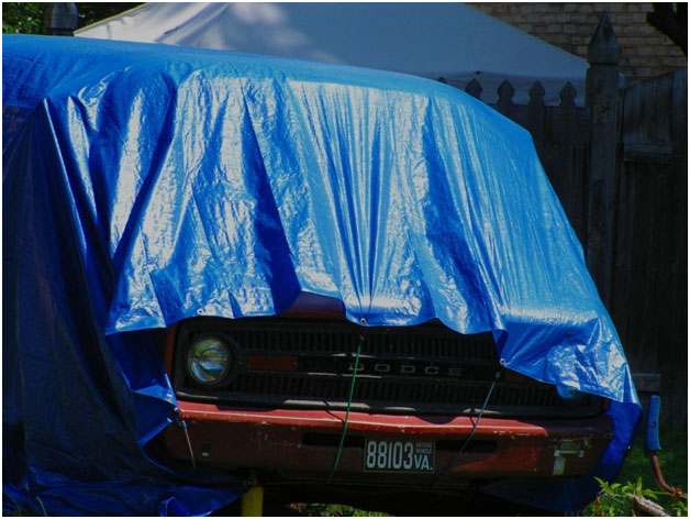 car coved with tarp